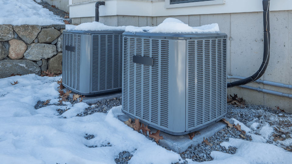 old HVAC system out in the snow